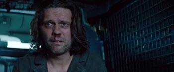 Movie still from “Mission: Impossible - Ghost Protocol” (2011), directed by Brad Bird – A person with long dark hair; Close Up shot, Over the shoulder angle