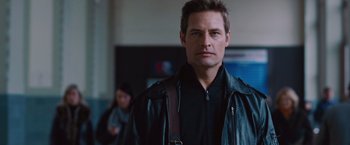 Movie still from “Mission: Impossible - Ghost Protocol” (2011), directed by Brad Bird – A person wearing a leather jacket; Close Up shot, Over the shoulder angle