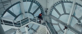 Movie still from “Mission: Impossible - Ghost Protocol” (2011), directed by Brad Bird – A man standing on top of a set of stairs; Wide shot, Low angle