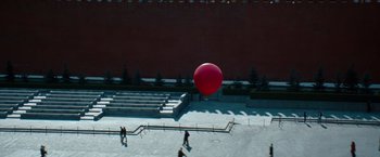 Movie still from “Mission: Impossible - Ghost Protocol” (2011), directed by Brad Bird – A large red balloon floating in the air; Extreme Wide shot, Overhead angle