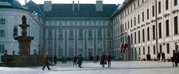 Movie still from “Mission: Impossible - Ghost Protocol” (2011), directed by Brad Bird – A group of people walking in front of a large building; Extreme Wide shot, High angle