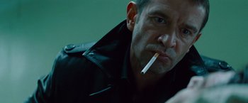Movie still from “Mission: Impossible - Ghost Protocol” (2011), directed by Brad Bird – A person with a cigarette in his mouth; Close Up shot, Low angle