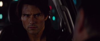 Movie still from “Mission: Impossible - Ghost Protocol” (2011), directed by Brad Bird – A person in a car at night; Close Up shot, Over the shoulder angle