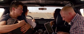Movie still from “Mission: Impossible - Ghost Protocol” (2011), directed by Brad Bird – Two people in a car looking out the window; Medium shot, Over the shoulder angle