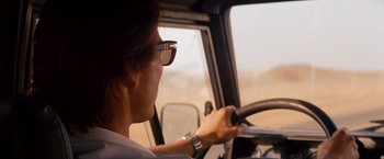 Movie still from “Mission: Impossible - Ghost Protocol” (2011), directed by Brad Bird – A woman driving a car in the middle of the day; Close Up shot, Low angle