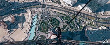 Movie still from “Mission: Impossible - Ghost Protocol” (2011), directed by Brad Bird – A man standing on the top of a building; Wide shot, Overhead angle