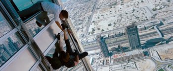 Movie still from “Mission: Impossible - Ghost Protocol” (2011), directed by Brad Bird – Two people are standing on the edge of a skyscraper; Wide shot, Overhead angle