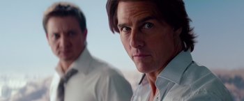 Movie still from “Mission: Impossible - Ghost Protocol” (2011), directed by Brad Bird – A man in a white dress shirt and a man in a white dress shirt; Close Up shot, Over the shoulder angle