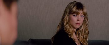 Movie still from “Mission: Impossible - Ghost Protocol” (2011), directed by Brad Bird – A beautiful young lady with long blonde hair and blue eyes; Close Up shot, Over the shoulder angle