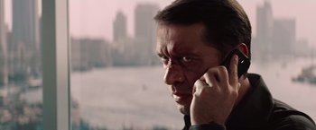 Movie still from “Mission: Impossible - Ghost Protocol” (2011), directed by Brad Bird – A person talking on a cell phone; Close Up shot, Low angle