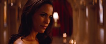 Movie still from “Mission: Impossible - Ghost Protocol” (2011), directed by Brad Bird – A beautiful young lady with long brown hair and green eyes; Close Up shot, Over the shoulder angle