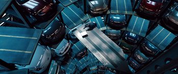 Movie still from “Mission: Impossible - Ghost Protocol” (2011), directed by Brad Bird – A bunch of cars that are in a parking garage; Extreme Wide shot, Overhead angle
