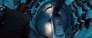 Movie still from “Mission: Impossible - Ghost Protocol” (2011), directed by Brad Bird – An overhead view of a car parked in a parking garage; Wide shot, Overhead angle