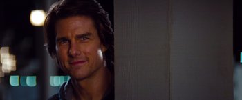Movie still from “Mission: Impossible - Ghost Protocol” (2011), directed by Brad Bird – A man's face in front of a wooden wall; Close Up shot, Over the shoulder angle