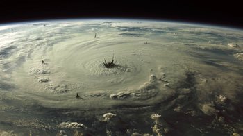 Movie still from “Oats Studios” (2017), directed by Neill Blomkamp – An aerial view of the earth from a space station; Extreme Wide shot, High angle