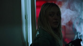 Movie still from “Oats Studios” (2017), directed by Neill Blomkamp – A woman with long blonde hair standing in front of a window; Close Up shot, Over the shoulder angle