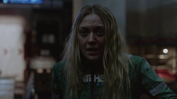 Movie still from “Oats Studios” (2017), directed by Neill Blomkamp – A person with long blonde hair; Close Up shot, Over the shoulder angle