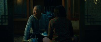 Movie still from “Okja” (2017), directed by Bong Joon Ho – A man and a woman sitting at a dinner table; Medium shot, Over the shoulder angle