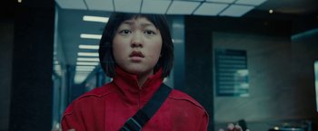 Movie still from “Okja” (2017), directed by Bong Joon Ho – A young girl in a red jacket is looking out of a window; Close Up shot, Low angle