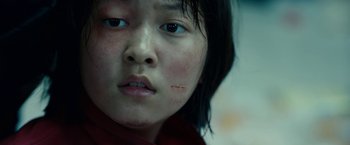 Movie still from “Okja” (2017), directed by Bong Joon Ho – A young girl's face; Extreme Close Up shot, Low angle