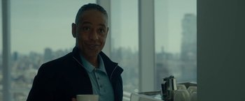 Movie still from “Okja” (2017), directed by Bong Joon Ho – A man holding a coffee mug in front of a window; Close Up shot, Over the shoulder angle