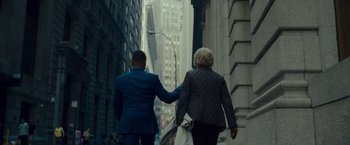 Movie still from “Okja” (2017), directed by Bong Joon Ho – A man and a woman walking down a street holding hands; Wide shot, Over the shoulder angle