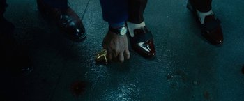 Movie still from “Okja” (2017), directed by Bong Joon Ho – A man holding a gun while standing next to a woman; Extreme Close Up shot, Overhead angle