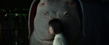 Movie still from “Okja” (2017), directed by Bong Joon Ho – A woman standing in front of an elephant; Close Up shot, Low angle
