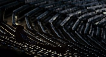 Movie still from “Moneyball” (2011), directed by Bennett Miller – A person is standing on a bench in a stadium; Extreme Wide shot, High angle