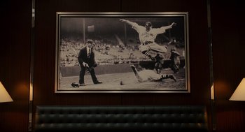 Movie still from “Moneyball” (2011), directed by Bennett Miller – An old photo of a professional baseball game in progress; Wide shot, Low angle