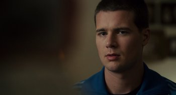 Movie still from “Moneyball” (2011), directed by Bennett Miller – A person wearing a blue shirt; Close Up shot, Over the shoulder angle