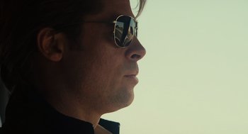 Movie still from “Moneyball” (2011), directed by Bennett Miller – A person wearing a pair of sunglasses; Close Up shot, Low angle
