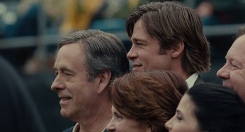 Movie still from “Moneyball” (2011), directed by Bennett Miller – A group of people standing next to each other; Close Up shot, Over the shoulder angle