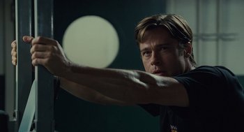 Movie still from “Moneyball” (2011), directed by Bennett Miller – A person holding something in his hand; Close Up shot, Low angle