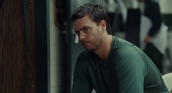 Movie still from “Moneyball” (2011), directed by Bennett Miller – A person wearing a green shirt; Close Up shot, Over the shoulder angle