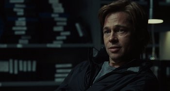 Movie still from “Moneyball” (2011), directed by Bennett Miller – A person sitting in a chair; Close Up shot, Over the shoulder angle