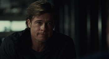 Movie still from “Moneyball” (2011), directed by Bennett Miller – A person wearing a black jacket; Close Up shot, Over the shoulder angle