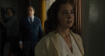 Movie still from “Operation Finale” (2018), directed by Chris Weitz – A man and a woman standing next to each other in a room; Close Up shot, Over the shoulder angle