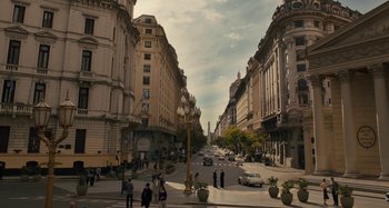 Movie still from “Operation Finale” (2018), directed by Chris Weitz – A city street filled with lots of people and tall buildings; Extreme Wide shot, High angle