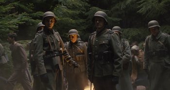 Movie still from “Operation Finale” (2018), directed by Chris Weitz – A group of men dressed in military uniforms; Medium shot, Low angle