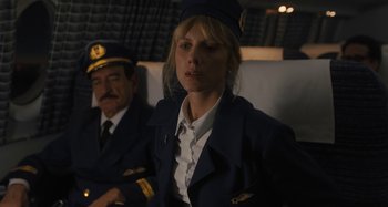 Movie still from “Operation Finale” (2018), directed by Chris Weitz – A woman in a uniform and a man in a uniform; Medium shot, Low angle