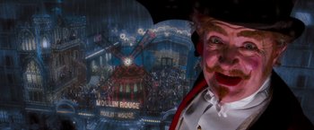 Movie still from “Moulin Rouge!” (2001), directed by Baz Luhrmann – A man with a clown mask; Close Up shot, Low angle