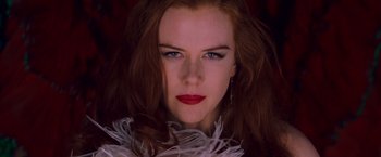 Movie still from “Moulin Rouge!” (2001), directed by Baz Luhrmann – A person with long hair; Close Up shot, Low angle