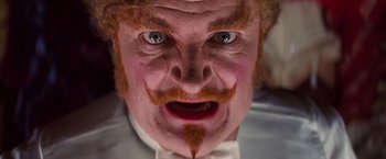 Movie still from “Moulin Rouge!” (2001), directed by Baz Luhrmann – The face of a man dressed as a clown; Extreme Close Up shot, Overhead angle