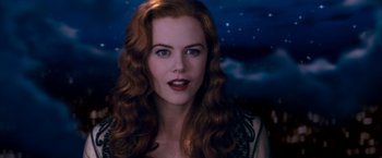 Movie still from “Moulin Rouge!” (2001), directed by Baz Luhrmann – A person with long red hair; Close Up shot, Over the shoulder angle