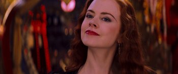 Movie still from “Moulin Rouge!” (2001), directed by Baz Luhrmann – A person with red hair; Close Up shot, Over the shoulder angle