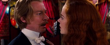 Movie still from “Moulin Rouge!” (2001), directed by Baz Luhrmann – A man and a woman face to face in front of a mirror; Close Up shot, Over the shoulder angle