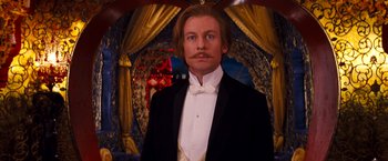 Movie still from “Moulin Rouge!” (2001), directed by Baz Luhrmann – A man in a suit and a bow tie; Close Up shot, Low angle