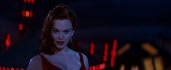 Movie still from “Moulin Rouge!” (2001), directed by Baz Luhrmann – A woman with red hair and a red dress; Close Up shot, Over the shoulder angle
