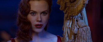 Movie still from “Moulin Rouge!” (2001), directed by Baz Luhrmann – A woman's face in front of a mirror; Close Up shot, Over the shoulder angle